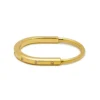 Tiffany & Co. Tiffany & Co. Lock Bangle In Yellow Gold With Diamond Accents 70185407